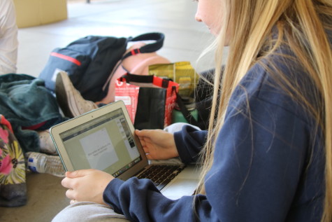 Junior Ally Dowse studies her Quizlet at lunch.