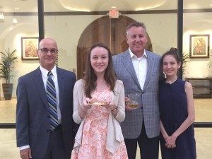 Megan Murphy '17 and Madison Kloeber '18 take part in the Mass with their dads.