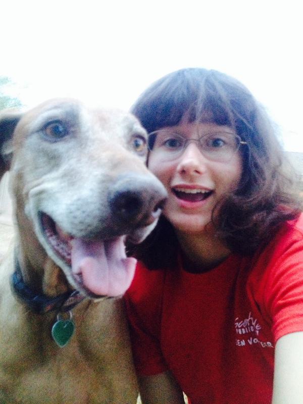 Susan takes a selfie with her dog.