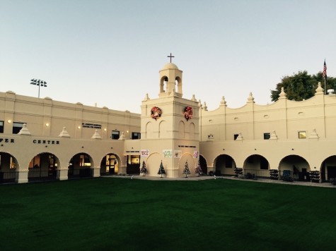The bell tower is decked with festive wreaths. 