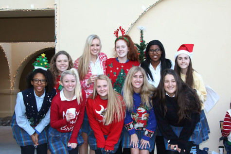 Senior Student Council poses in front of their decorated Tree of Peace.