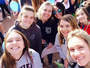 Mrs. Tara Patterson, Coordinator of Campus Evangelization, enjoys the rally with Xavier students.