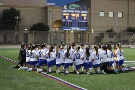 The Xavier varsity soccer team celebrates an incredible season.