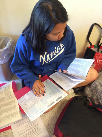 A senior prepares for her final AP exams at Xavier