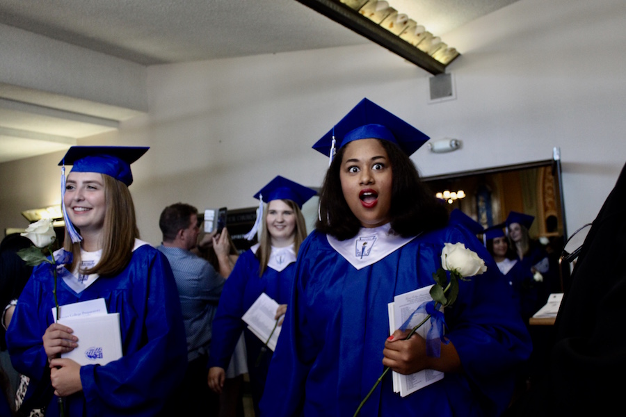 Maria White looks on in shock while exiting Xaviers seventy-first annual commencement ceremony at St. Francis Xavier Church on Sat., May 13, 2017.