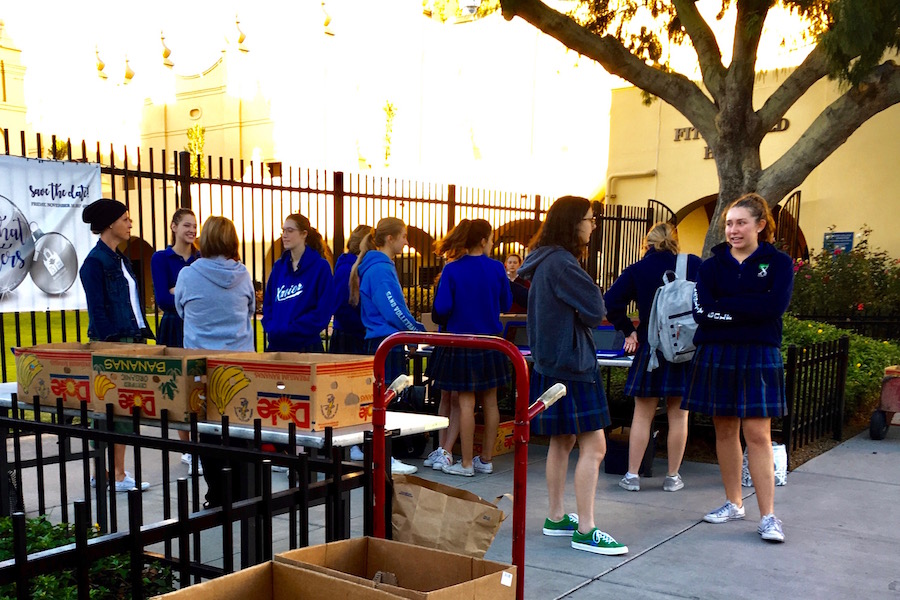 Xavier students donating canned goods and money for the annual food drive at Xavier College Prep on Thursday, Nov. 9, 2017.