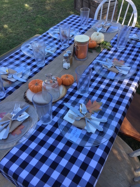 The+table+setting+for+Friendsgiving+is+often+decked-out+with+pumpkins%2C+candles+and+a+welcoming+tablecloth.+