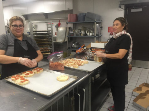 Xavier's kitchen staff makes pizzas for lunch. 