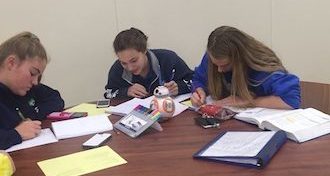 Xavier students preparing for the upcoming finals in Founders Hall.