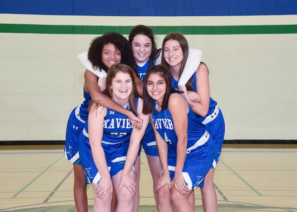 Senior basketball girls are posing on picture day. Mary Long, Katie Hassett, Isabel Wirth, Payton Davis and Montana Oltrogge are ready for State. 