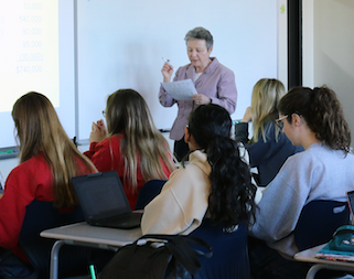 Mrs. Barbra Bond teaches students in the College-Level Accounting class on Feb. 26, 2018.