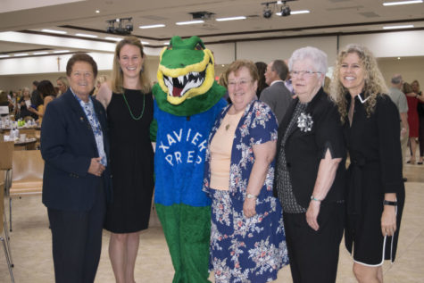 From left to right, Sister Lynn, Kathryn Post ‘07, Ali the Gator, Sister Joanie, Sister Joan, and Jeannette Maré pose for a photograph. Photo courtesy of the Xavier Advancement Department.