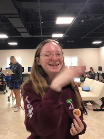 April Platt '19 swats a moth that flies in from of her face