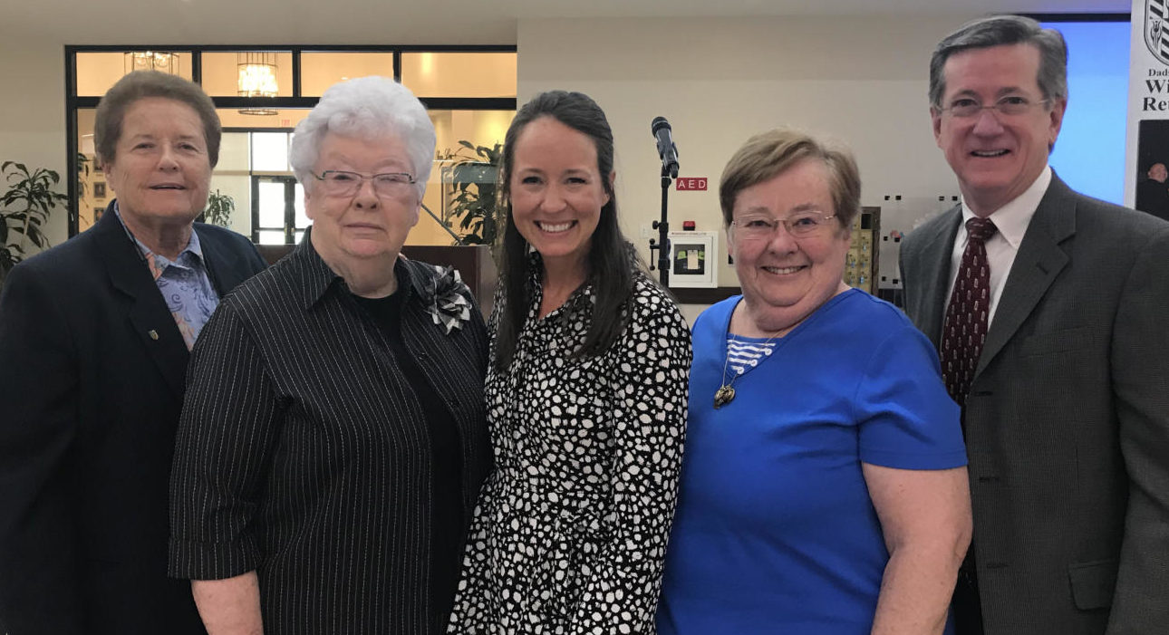 From left to right, Sister Lynn, Sister Joan, Michelle Shipley, Sister Joanie, and Tom Schmitt pose for a photograph at the Father Daughter Mass. Photograph courtesy of Jeri Butts.