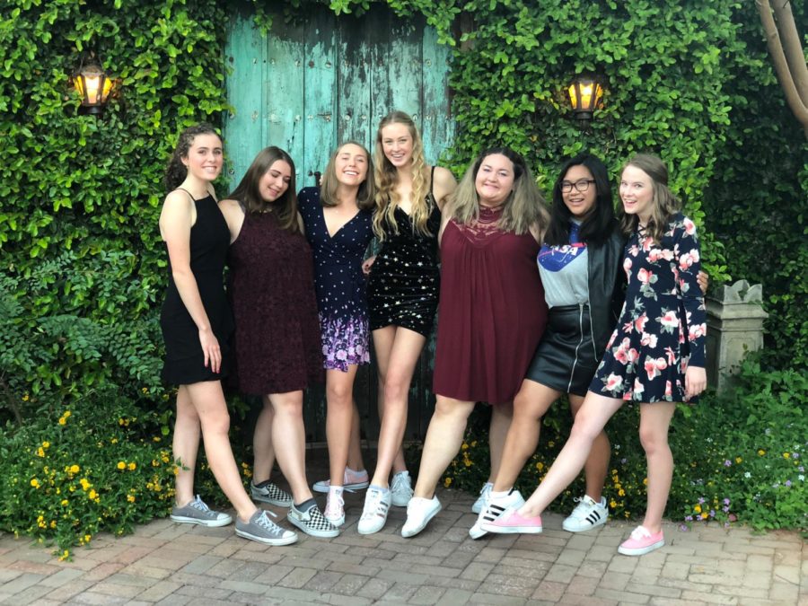 Friends pose for Homecoming in modern styles