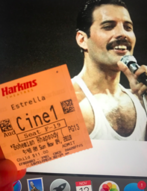 A photo of Freddie Mercury in the 1985 Live Aid concert and a ticket to the movie Bohemian Rhapsody. The film is currently being shown at most Harkins Theaters around the valley.