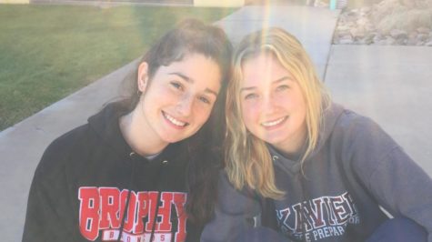 Seniors Eve Loughran and Lindsay Hubbard pose in their sweans attire, each having donated money to the Damien House cause. Photo courtesy of Johnnie Mitchell.