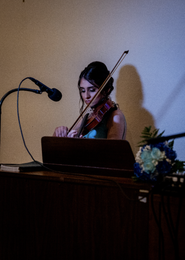 Xavier junior Edyta Zimny playing the violin. Photo by Tobias Ogden of Image in Love Photography. 
