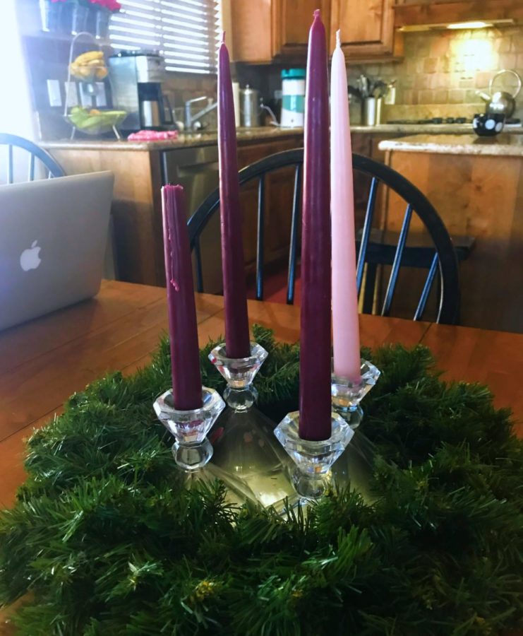 An Advent wreath sitting on a kitchen table. 