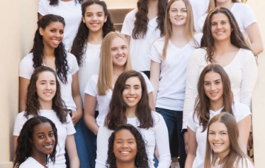 Xaviers Varsity Basketball team with the senior captains Leilani McIntosh, Addie Putnam, and Paris Rasheed-Moore featured in the front row. Photo courtesy of Duke Photography.
