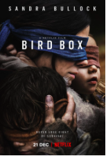 Sandra Bullock as her character Malorie in the Netflix film Birdbox. She is blindfolded holding her two children, Boy and Girl. 