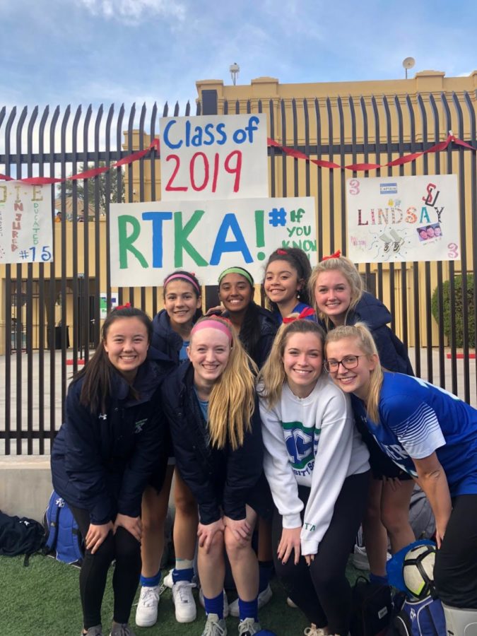 Seniors Caitlin Johnson, Sadie Wintergalen, Emily Chiao, Lindsay Hubbard, Katie McGee and Allie Broderick, Karla Alvarado, and Kelli Rasmussen pose pre-game. 