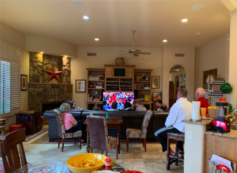 Brophy and Xavier students gather to watch Super Bowl LIII on Sunday Feb 3. Food was provided on the table, while the game was going on. As well as a friendly betting board located to the far right of the image. Photo Courtesy of Junior Sophia Salome.
