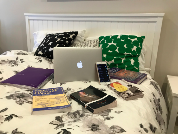 Pictured above is an assembly of common distractions that disrupt Xavier students sleeping schedules. This consists of technology and homework. Photo courtesy of Lily Tierney 19.