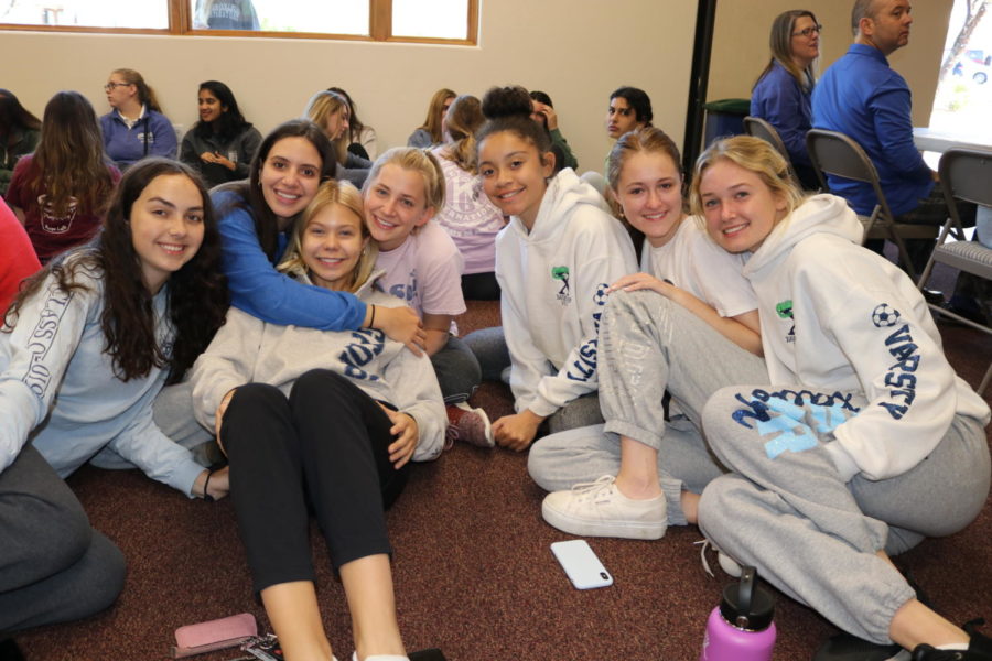 Seniors get cozy in their sweans for their final Prayer Day 