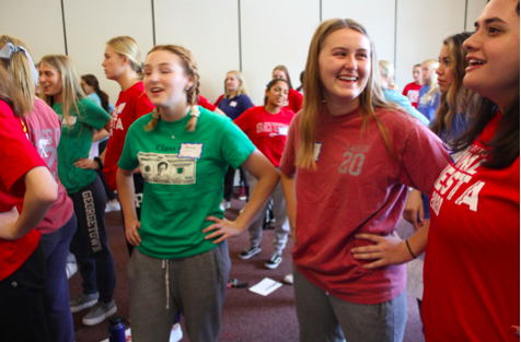 Taylor Garman ‘20, Emma Elsbecker ‘20, and Angelina Abdeen ‘20 giggle while embracing the lighthearted nature of Senior Prayer Day. This picture was taken during Activity A with Ms. Cavnar as the girls did a warm up activity to become even more familiar with their peers. Photo Courtesy of Meghan Galbreath ‘20. 
