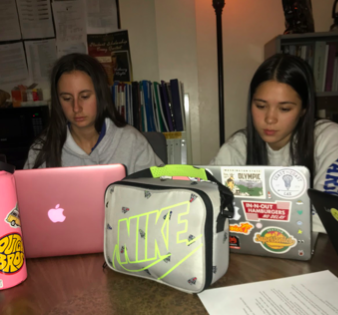 Olivia Petrine 20’ and Nina Mackey 20’ working on homework. Photo credit: Mia Parham 20
