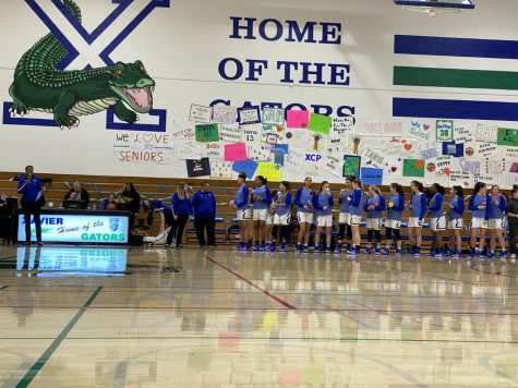 Varsity Basketball Coach Gillom speaks to fans, family members, and members of the Basketball and Gatorline teams. Coach Gillom thanked senior athletes for their hard work and recognized families for their commitment. Photo by Caroline Hink '20.
