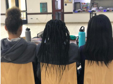 Kaila Hunley ‘20, Anyang Celbirio ‘20, and Maia Weingard ‘22 showing the different hairstyles black women may wear. Photo Credit: Mia Parham ‘20
