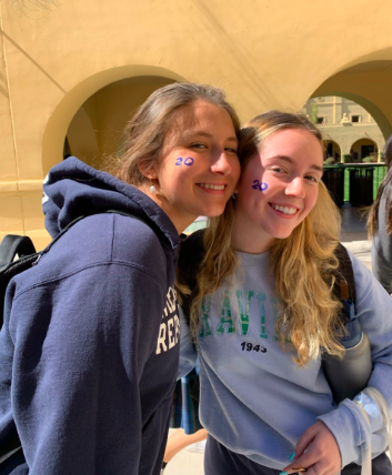 Seniors Analy Carbine ‘20 and Emma Broderick chose to have their graduation year painted on their face to celebrate Traditions Week. Photo credit: Emma Broderick ‘20.