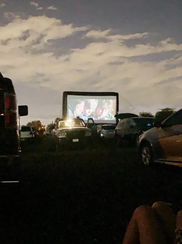 Night falls as The Goonies entertains drive-in guests.

