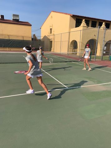 Baby gator Ashley Mansour gets ready to return the ball during after school frosh tennis practice!