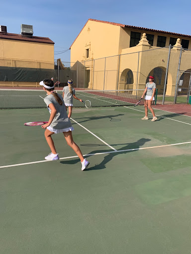 Baby gator Ashley Mansour gets ready to return the ball during after school frosh tennis practice!  