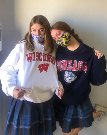 Seniors Reese Dietrich and Kassidy Espinosa pose in their college gear on College Sweatshirt Day.