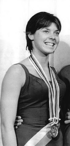 Jeanne Collier, who graduated from Xavier College Prep in 1964, poses with her silver medal for diving after the Tokyo Olympics medal ceremony in 1964.