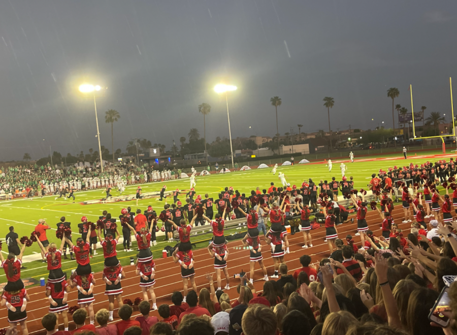 During the first moments of the game, students get ready for the initial kickoff. This kickoff started the first victorious football game of the season against St. Mary’s Catholic High School. 
