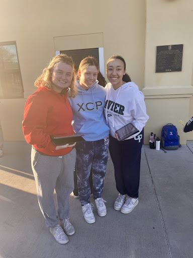 National Honor Society members collect money and cans on Wednesday's “Can Your Skirt” day. Students are able to wear sweats or jeans for the day if they donate $5 or 10 cans. 