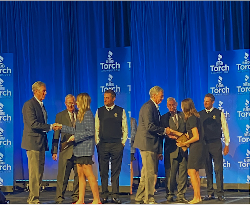 Joan Walton ‘23 (left) and Sonya Colattur ‘24 (right) walk on stage to receive their checks for being finalists in the 2021 BBB Ethics Essays Competition. Their essays were inspiring to many.
