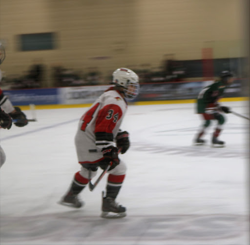 On November 13, at Ice Den Scottsdale, senior Marissa White makes her way to the Bronco’s side of the rink on a fast break. Brophy tied against the JV Mountain Ridge Mountain Lions, 1-1.