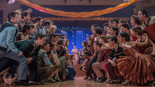 Taken from a moment in the film “West Side Story,” this scene captures the rivalry between the two groups. This scene also showcased the captivating energy and beautiful costumes in the film. 