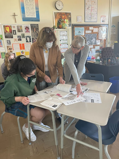 Nina Rawal, founder of the Xavier NEHS, sits with Kelly Hubbard and Lisa Galbreath while planning the activities for the future of the society. They have been working closely to outline plans for the society and its future. 