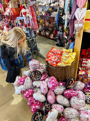 Sophomore Bryce Mueller ‘24 goes to AJ’s Fine Foods to get items for a Valentine’s Day party with her friends. She searched for balloons, red and pink treats and anything else to make the holiday special.