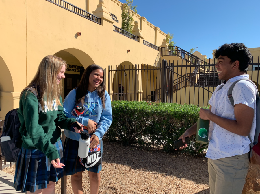 Lucy Shanahan '24 (left), Makayla Marshall '24 (middle) and Nate George '24 (right) meet to talk and laugh about a trivial matter after school. This friendship is the epitome of how men and women can thrive in friendship, especially by making each other happy through laughter. 