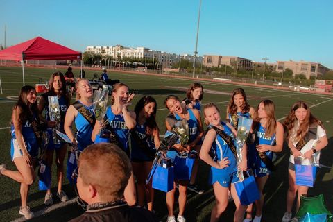 Seniors in Track and Field pose with their treats on Senior Night. This was the first-ever Senior Night for the team and was coordinated by junior Madigan Moran.