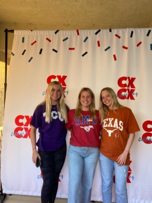 Xavier seniors MarySue Dickens, Isabella Buse and Regan Perrin gather for a photo in their selected college apparel. They are celebrating their decisions with the company College X-ing, which counsels students in their applications and college decision-making processes. 