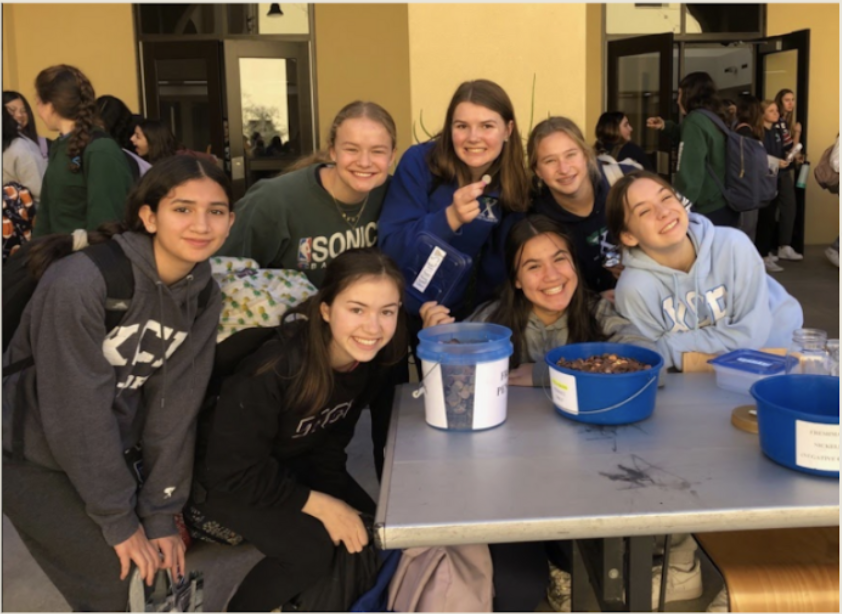 Junior Student Council smiles for the Penny Wars. Penny wars was a competition during Catholic Schools Week to see which class could rally the most pennies to raise funds for charities. 